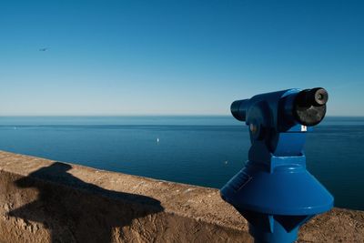 Scenic view of sea against blue sky