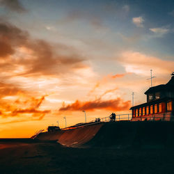 Scenic view of sea against orange sky