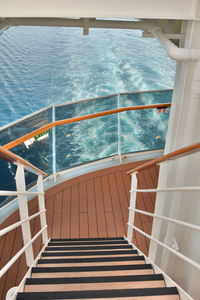 Staircase by sea against sky