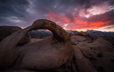 Rock formation against sky during sunset