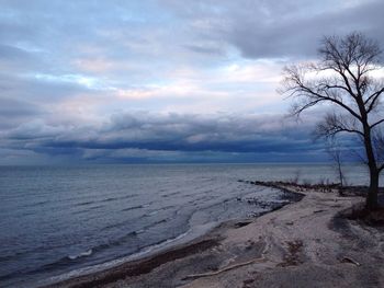 Scenic view of sea against cloudy sky