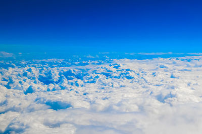 Aerial view of dramatic landscape against clear blue sky