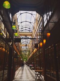 People walking in illuminated building