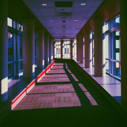 Empty walkway leading towards building