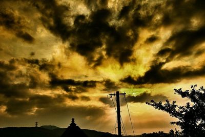 Low angle view of cloudy sky at sunset