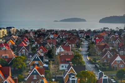 High angle view of townscape by sea