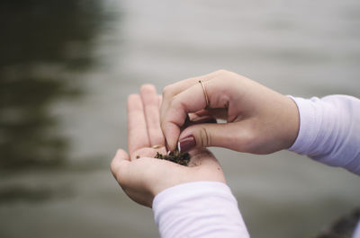 Close-up of woman holding hands