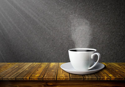 Close-up of coffee cup on table