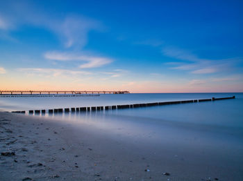 Scenic view of beach against sky during sunset