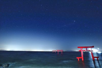 Scenic view of sea against sky at night