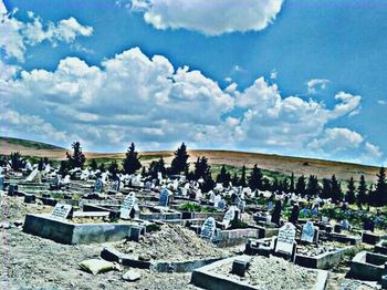 View of cemetery against cloudy sky