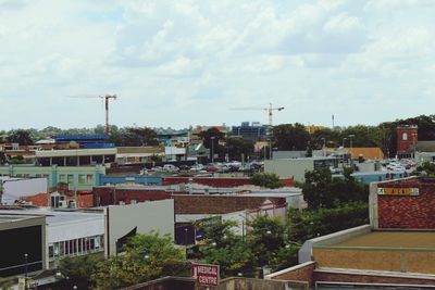 Residential buildings against cloudy sky