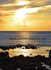 Scenic view of sea at sunset