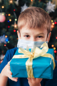 Portrait of cute girl holding gift