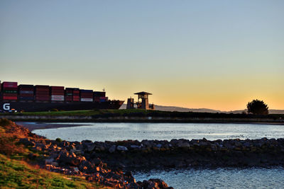 Scenic view of sea against clear sky during sunset