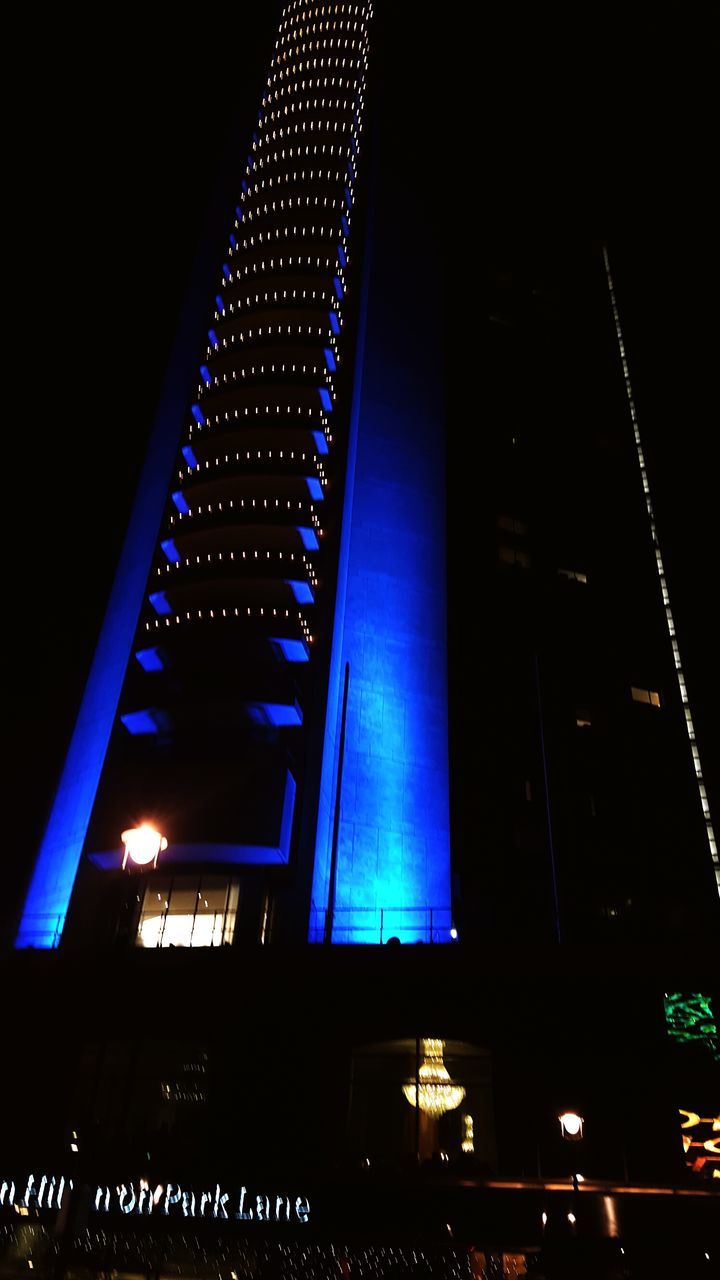 illuminated, night, low angle view, architecture, built structure, building exterior, lighting equipment, modern, city, light - natural phenomenon, building, blue, glowing, sky, office building, no people, electric light, dark, street light, light