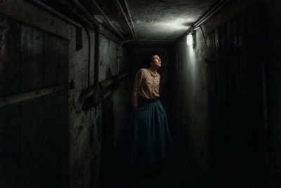 Man standing in abandoned building