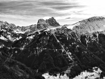 Scenic view of snowcapped mountains against sky