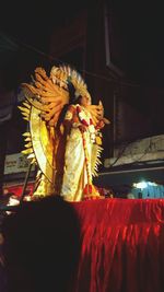 Low angle view of illuminated statue at night