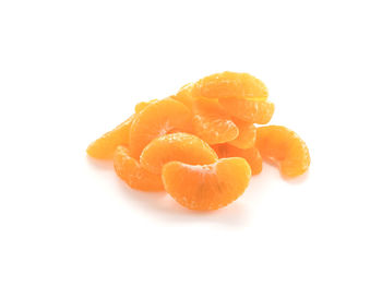 Close-up of orange fruit against white background