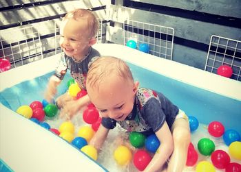 Happy boy playing in swimming pool