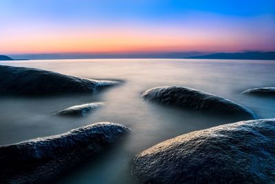 Scenic view of sea against sky during sunset