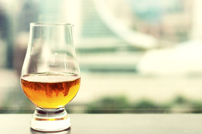 Close-up of beer in glass on table