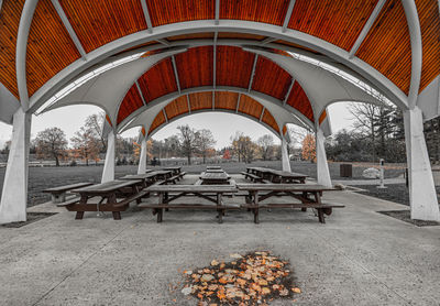 Empty benches and table in park