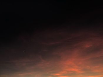 Low angle view of dramatic sky at sunset