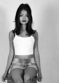 Portrait of a beautiful young woman over white background