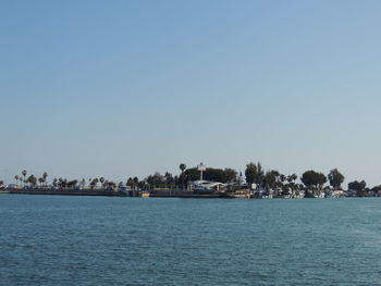 Scenic view of sea against clear blue sky