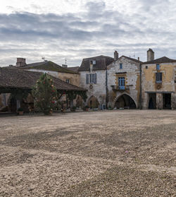 Old building in field against sky