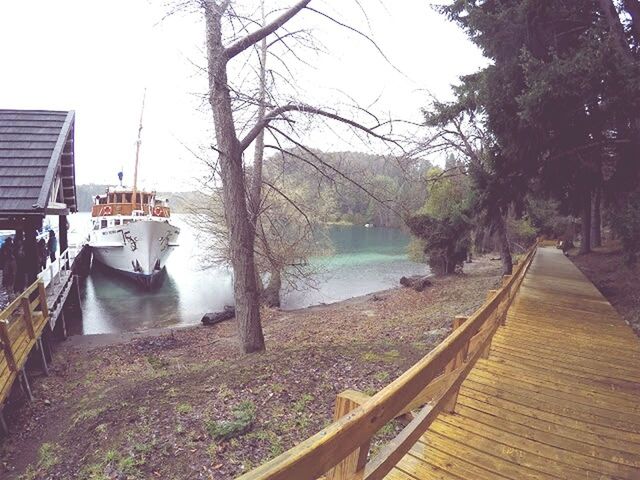 BOATS MOORED IN RIVER