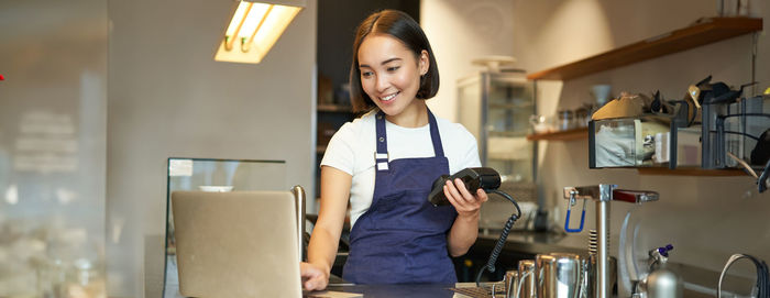 Portrait of young woman working at home