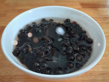 High angle view of bubbles for bubble tea in bowl on table