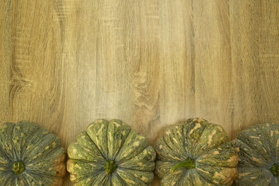 Close-up of gourds on wooden table