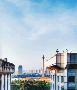 Low angle view of buildings against blue sky