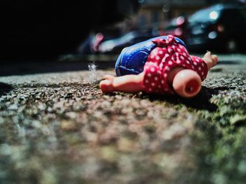 Close-up of stuffed toy on street