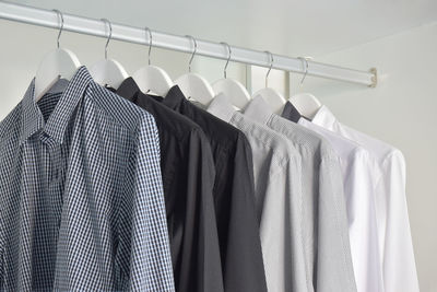 Row of clothes hanging in rack