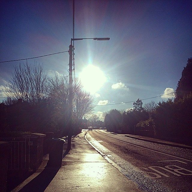 the way forward, transportation, sun, vanishing point, diminishing perspective, sunlight, railroad track, sky, road, empty, clear sky, lens flare, long, sunbeam, tree, silhouette, no people, sunset, street light, rail transportation