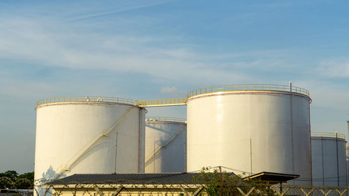 Fuel storage tanks against sky