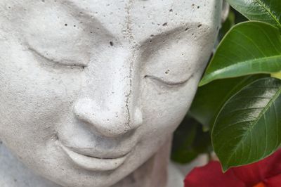 Close-up of smiling buddha statue 