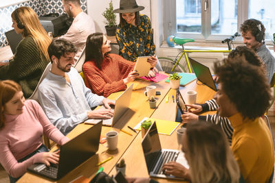 High angle view of business people working in creative office