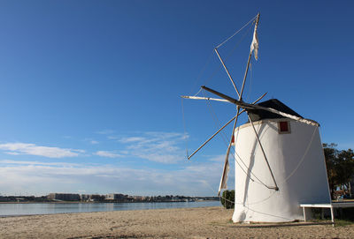 Traditional windmill against sky