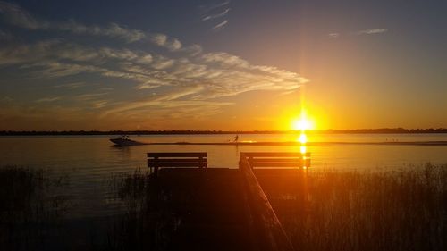 Scenic view of lake against sky during sunset