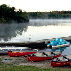 Boats moored in lake