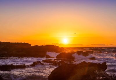 Scenic view of sea against sky during sunset