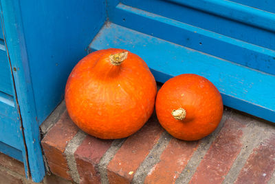 High angle view of orange pumpkins on wood