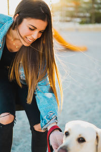 Young woman smiling while looking away