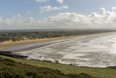 Scenic view of road by land against sky